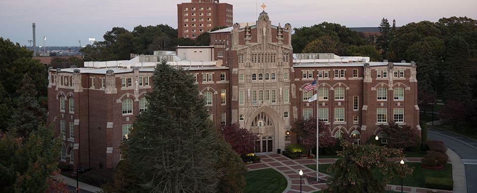 A view of Harkins Hall at sunset, the main administrative building on campus